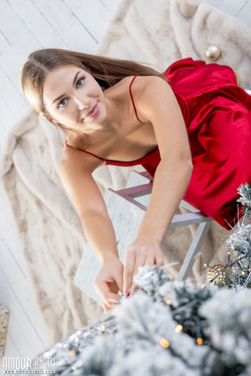 Nika poses with captivating confidence, her glowing skin kissed by natural light 02 pics